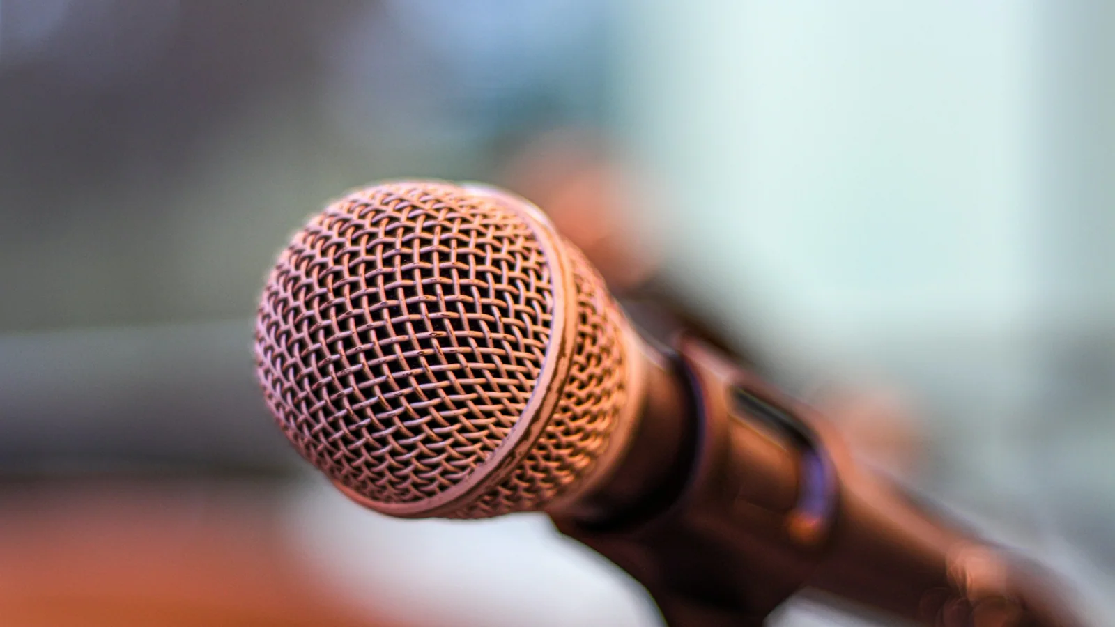 A studio microphone against a softly blurred background